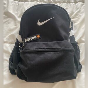 Nike Brasilia JDI Mini- Black Backpack with White Swoosh and 'Just Do It' Tag